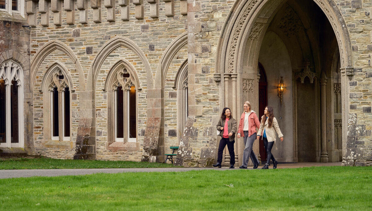 3 friends walking through Johnstown Castle grounds