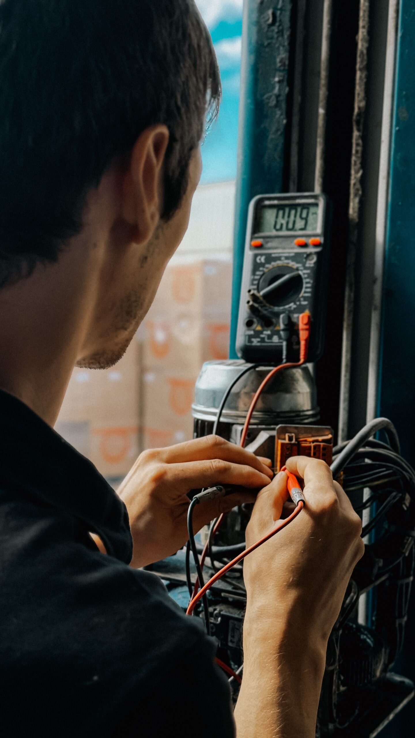 An electrician working with wires