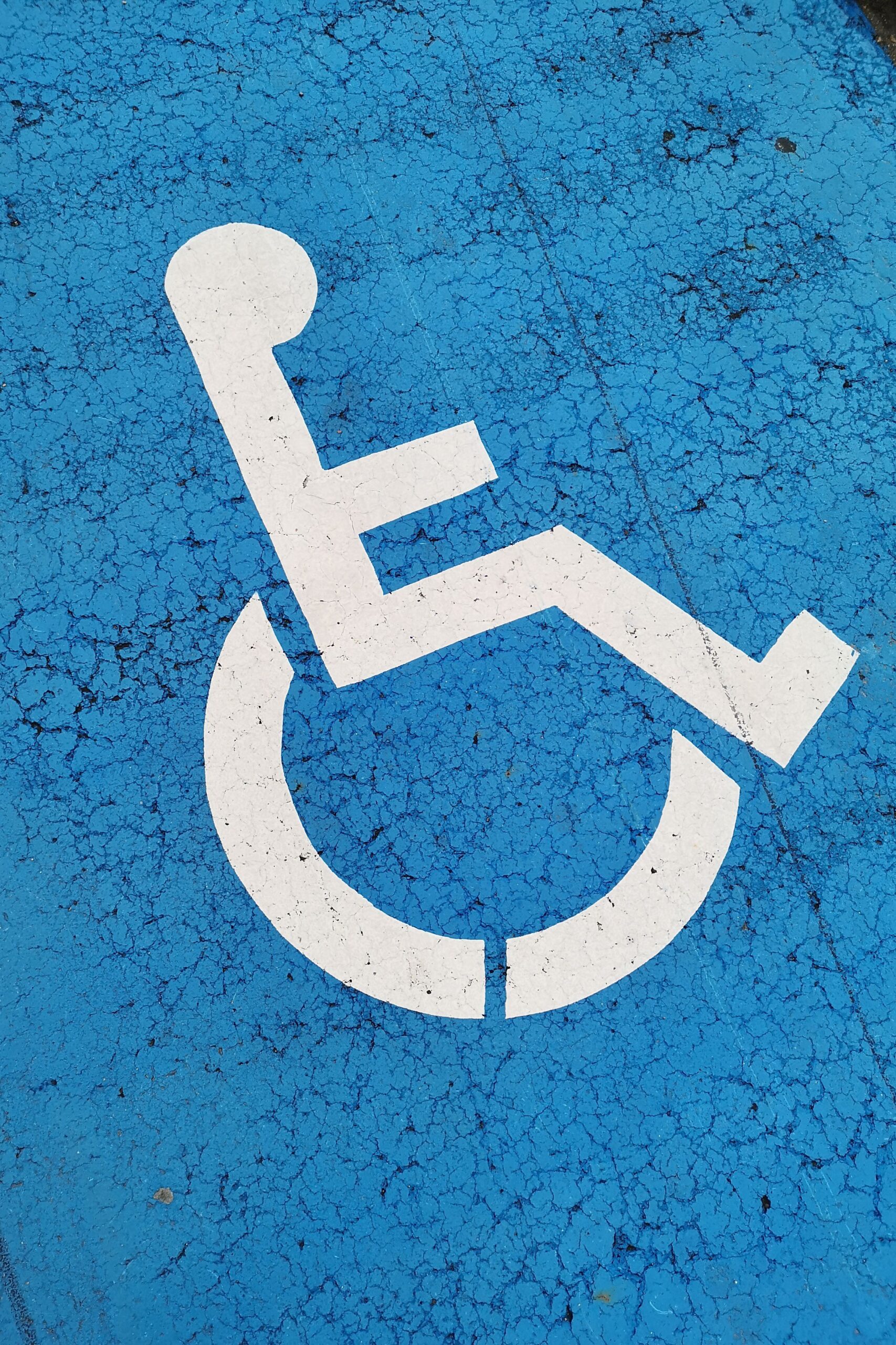 Blue box parking space with white wheelchair parking symbol