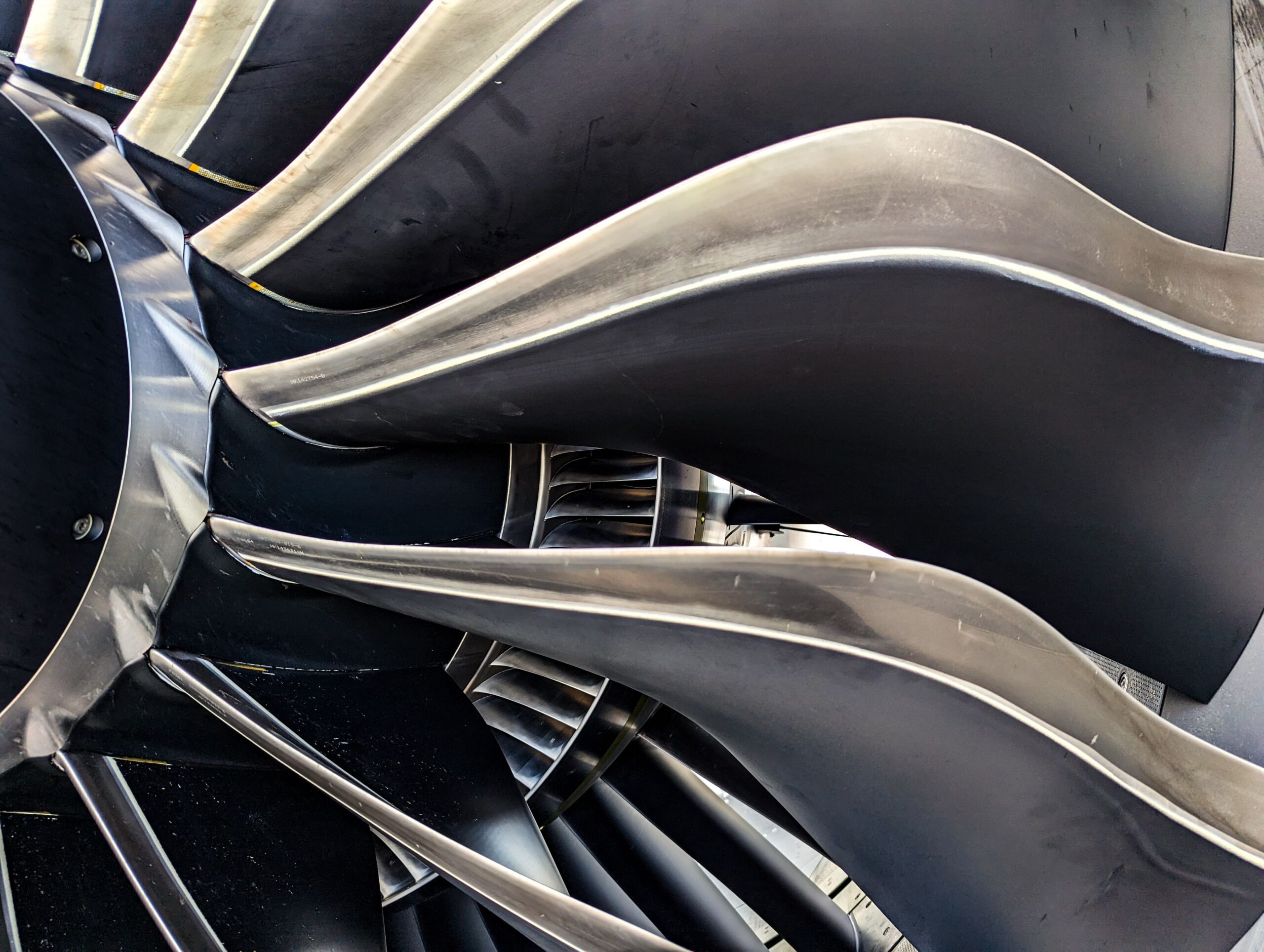 Detailed close-up of metal turbine blades showcasing engineering and aerodynamic design