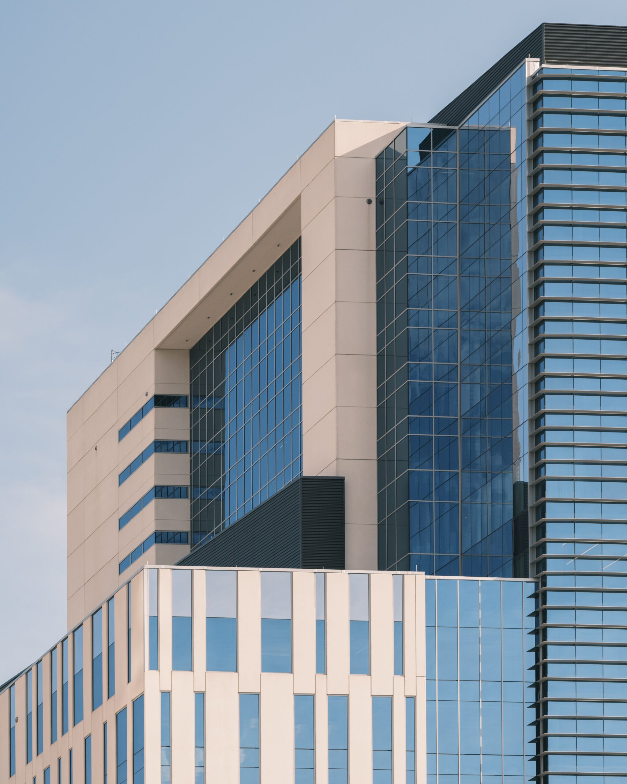 high rise buildings with large reflective windows
